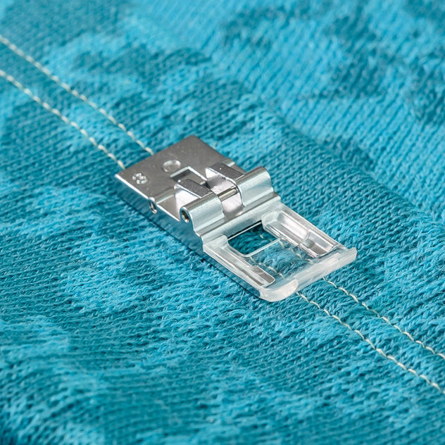 Clear view coverstich foot on blue fabric